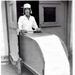Historic photo of an employee on the line blocking press at Radford Ordnance Works.