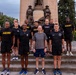 Senior officers conduct physical training during a visit from distinguished visitors at JBLM