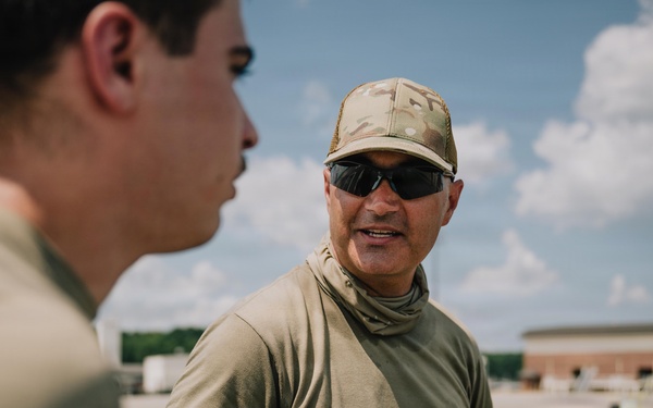 Judice briefs trainee during K-loader certification