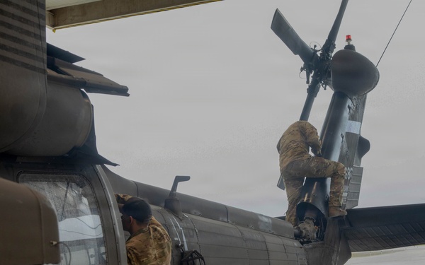 Green Berets, Alaska Army National Guard air crew prepare for RAPIDS infil to Savoonga during Operation Polar Dagger.