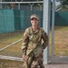 Sgt. Brianna Plush stands with Military Working Dog Edzsi