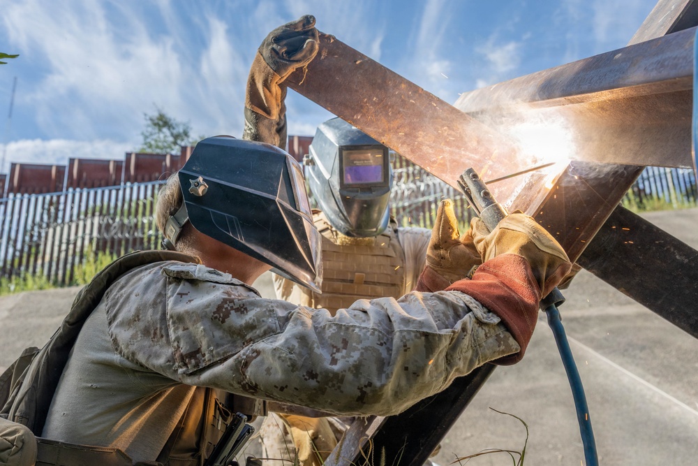 Forging Ahead: JTF-SB Marines weld and emplace fortifications along the southern border