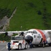 Coast Guard personnel compete to pull an HC-130J Super Hercules airplane in Kodiak, Alaska