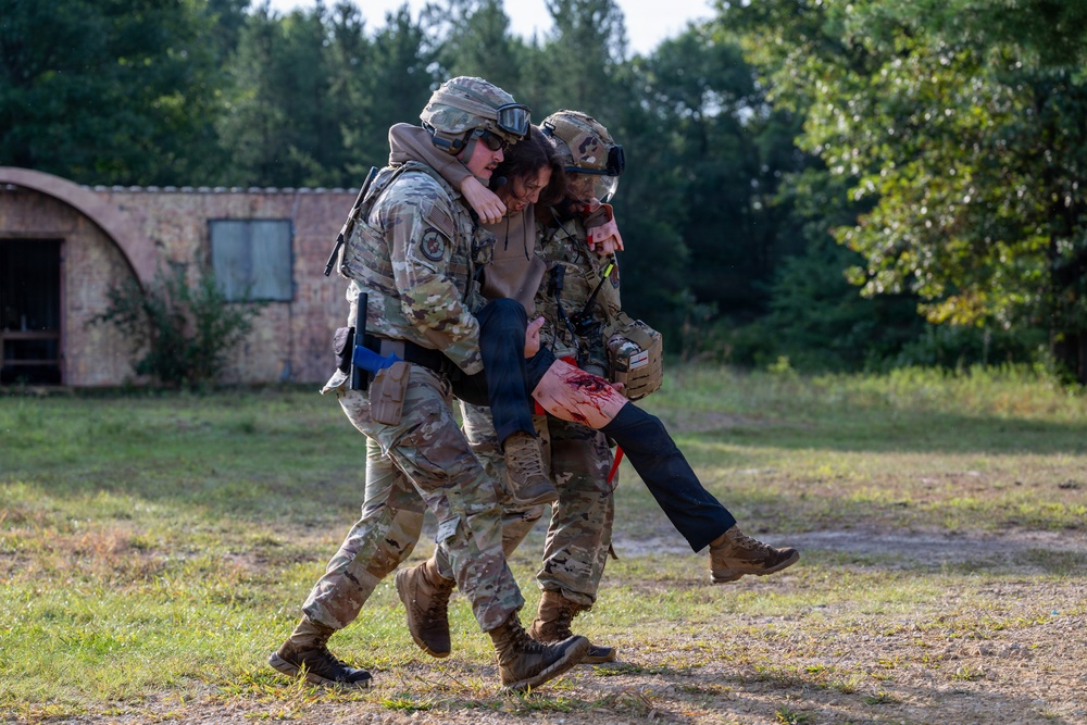Security forces Airmen deliver life-saving tactical combat casualty care following simulated tornado during Patriot 26