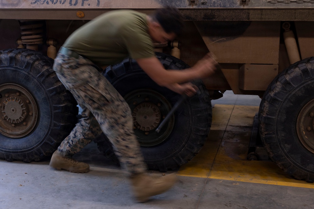 U.S. Marines with 1st LAR participate in tire change event during the Coral-Balmoral Cup