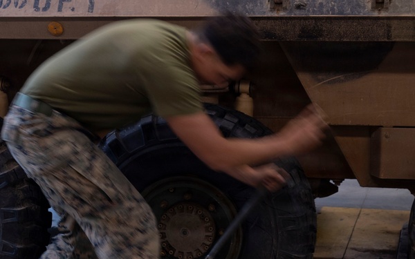 U.S. Marines with 1st LAR participate in tire change event during the Coral-Balmoral Cup
