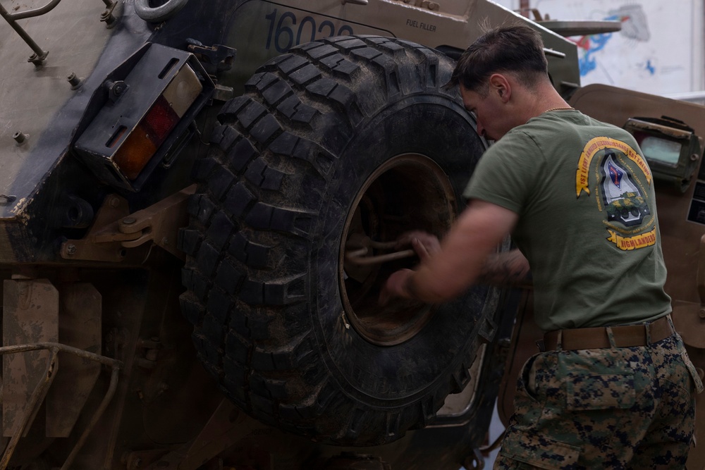 U.S. Marines with 1st LAR participate in tire change event during the Coral-Balmoral Cup