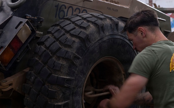 U.S. Marines with 1st LAR participate in tire change event during the Coral-Balmoral Cup