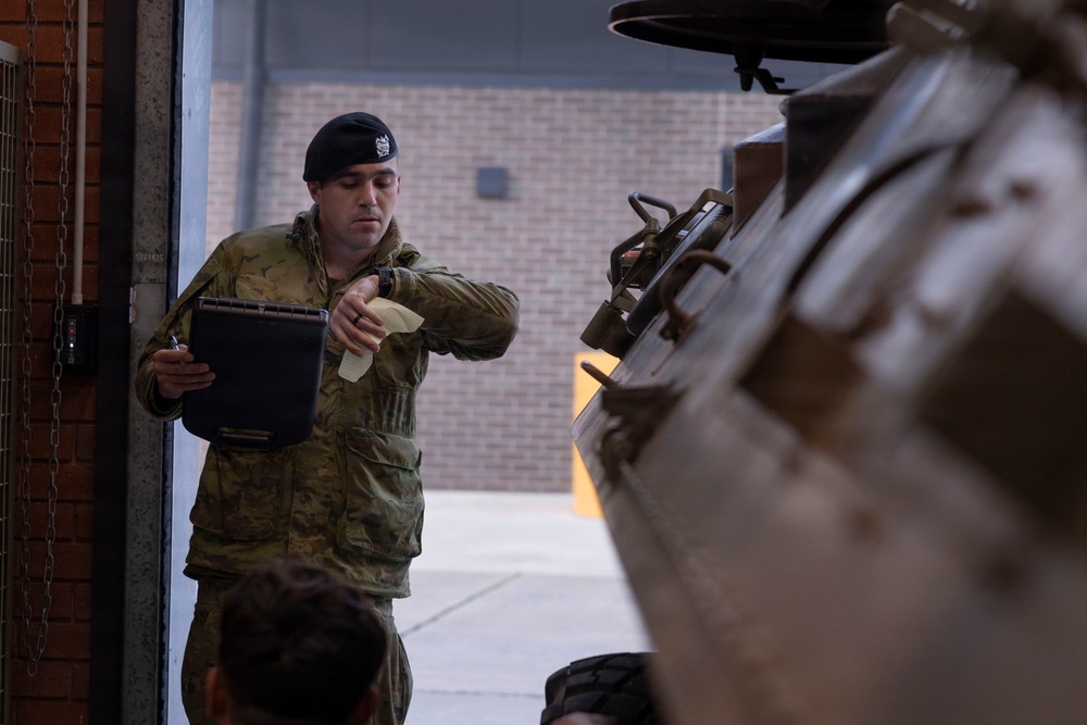 U.S. Marines with 1st LAR participate in tire change event during the Coral-Balmoral Cup