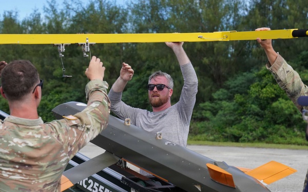 Soldiers load Red Wolf launched effect platform