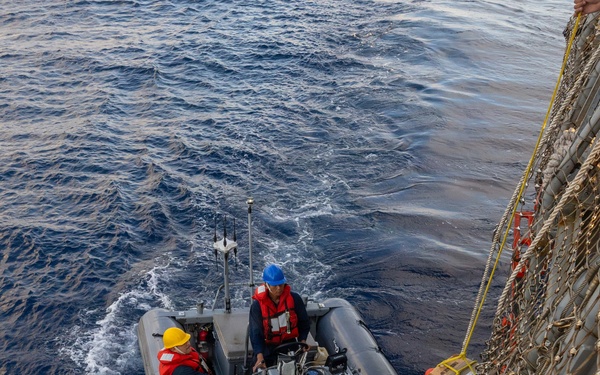 USS Mustin conducts boat operations