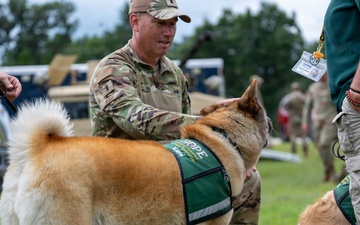 National Guard Soldiers, Airmen partner with therapy canines to boost morale, wellness at Patriot 26