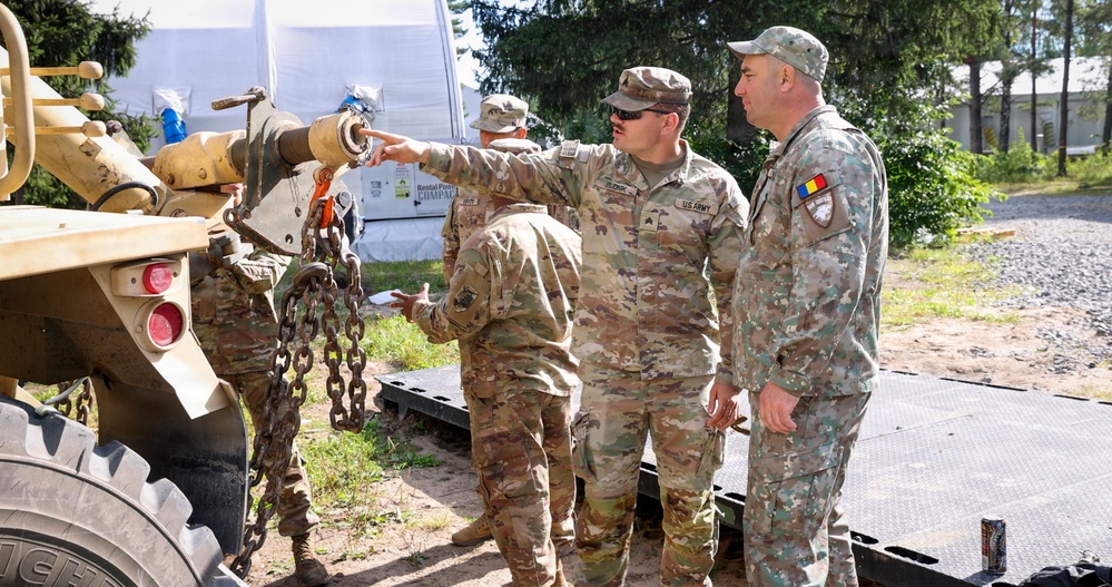 U.S. Soldiers cross train on vehicle recovery techniques with NATO allies in Poland
