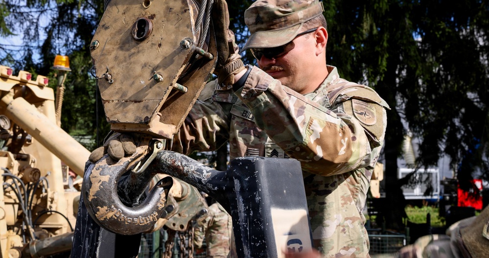 U.S. Soldiers cross train on vehicle recovery techniques with NATO allies in Poland
