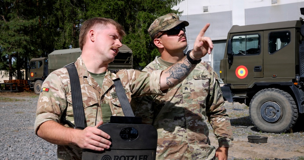 U.S. Soldiers cross train on vehicle recovery techniques with NATO allies in Poland