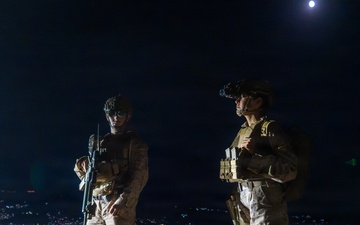 Sailor and Marine patrol the southern border