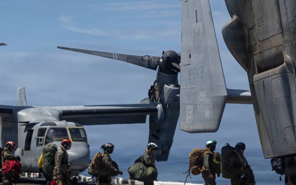 U.S Navy And Marine Corps Personnel Depart USS Makin Island
