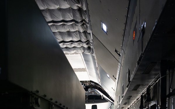 U.S. Marines, U.K. Airmen load Australian Strike Master vehicle onto Airbus A400M Atlas aircraft