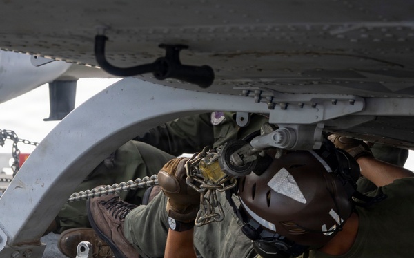 U.S. Marine Chains Down UH-1A Huey