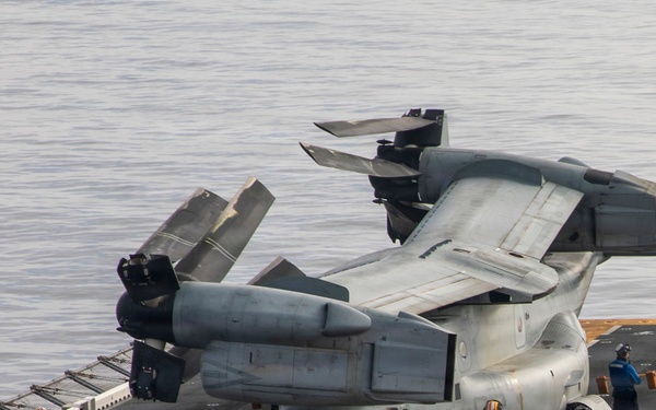 U.S. Navy Sailors Move an MV-22B Osprey