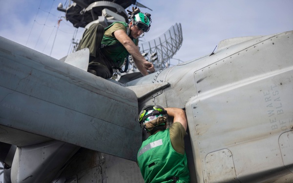 U.S. Marine Performs Maintenance on an MV-22B