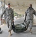 Army Spcs. Adam Schroeder (left) and Bernard Satchell