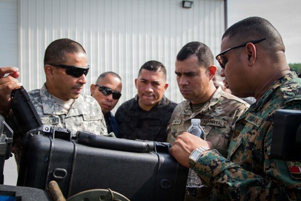 Capt. Richard Sambolin, a team member of the Missouri National Guard’s State Partnership Program with the country of Panama, shows off the different features of an emergency response vehicle during a tour of the Cooper Drive Armory, home of the 7th Civil Support Team, Jefferson City, Missouri. Panama and the Missouri National Guard have been partners in military training and advisement since 1995.