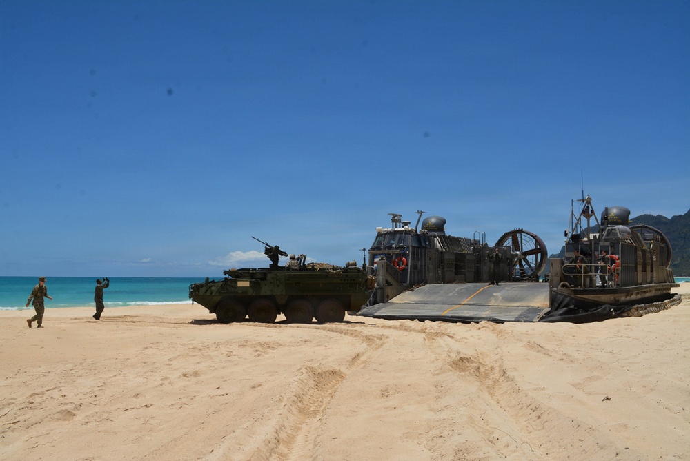 US Army Vehicles Depart a US Navy Hovercraft in Hawaii