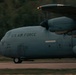 A U.S. Air Force C-130 Hercules military transport aircraft is captured in motion during what appears to be a takeoff or landing roll on a runway. The aircraft bears the markings '4635' and '86 AW' (86th Airlift Wing), indicating it is assigned to Ramstein Air Base, Germany. The image was taken with a panning technique, creating motion blur in the background while keeping the aircraft relatively sharp.