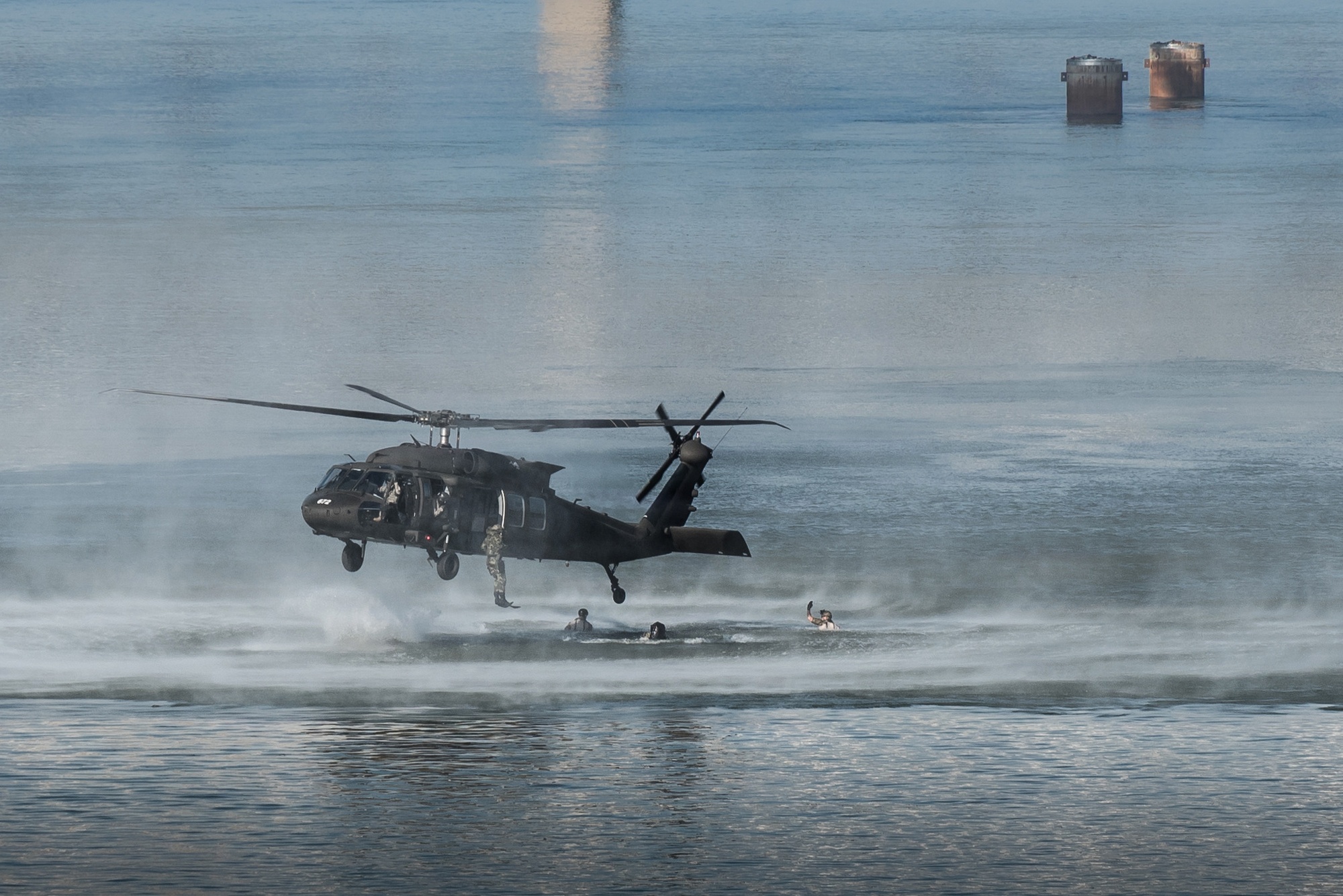 Combat controllers and pararescuemen from the Kentucky Air National Guard’s 123rd Special Tactics Squadron jump from a Kentucky Army National Guard UH-60 Blackhawk helicopter into the Ohio River during the Thunder Over Louisville air show in downtown Louisville, Ky., April 23, 2016. The demonstration displays techniques the Airmen use when recovering downed personnel or executing a covert insertion into enemy territory. (U.S. Air National Guard photo by Maj. Dale Greer)