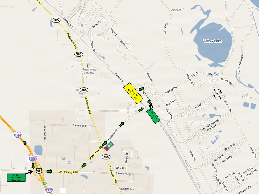 This is a road map showing directions to the Pine Bluff Arsenal (PBA) area near White Hall, Arkansas. The map highlights a route from Interstate 530 (Exit 32) along State Highway 256 and Dallaway Road, with green directional arrows guiding travelers to specific destinations marked in yellow and green boxes. Key landmarks include Yellow Lake, Musgrove Cemetery, PBA Conference Center, and Dilly Pond.