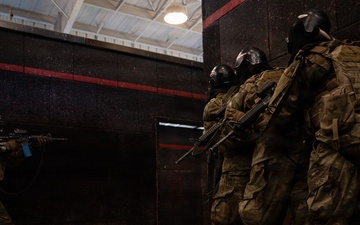 Security forces students practice room-clearing on JBSA