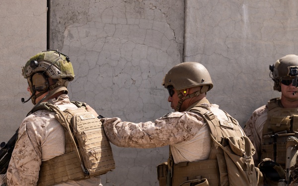 U.S. Marines with Echo Co., 2nd Bn., 1st Marines, execute urban squad assaults