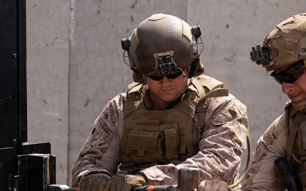 U.S. Marines with Echo Co., 2nd Bn., 1st Marines, execute urban squad assaults