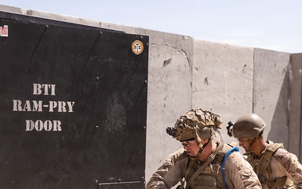 U.S. Marines with Echo Co., 2nd Bn., 1st Marines, execute urban squad assaults