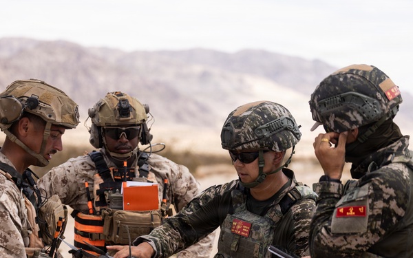 U.S. Marines with Echo Co., 2nd Bn., 1st Marines, execute urban squad assaults