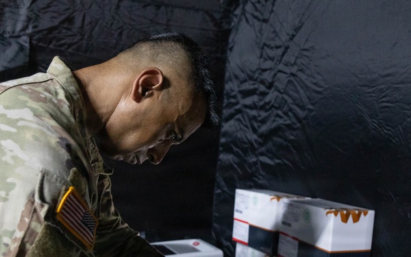 U.S. Army Maj. Sidhartha Chaudhaury works with mosquito DNA