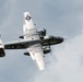 A vintage World War II-era American military bomber aircraft is photographed in flight from a low angle against an overcast sky. The aircraft displays USAAF markings including a white star insignia and the serial number 430734 on the tail. The plane appears to be a restored warbird, likely participating in an airshow or commemorative flight.