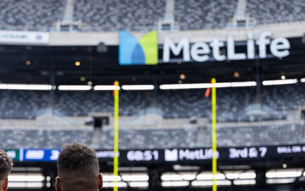 Marines, Soldiers, and families, represent Fort Hamilton during the Annual Salute to Service Bowl at MetLife Stadium.