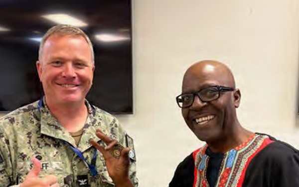Willie Walton receives coin for audit efforts