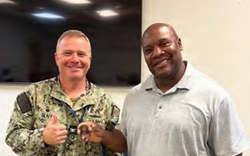 Lorenzo Solomon receives coin for audit efforts