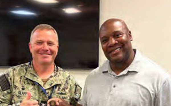 Lorenzo Solomon receives coin for audit efforts