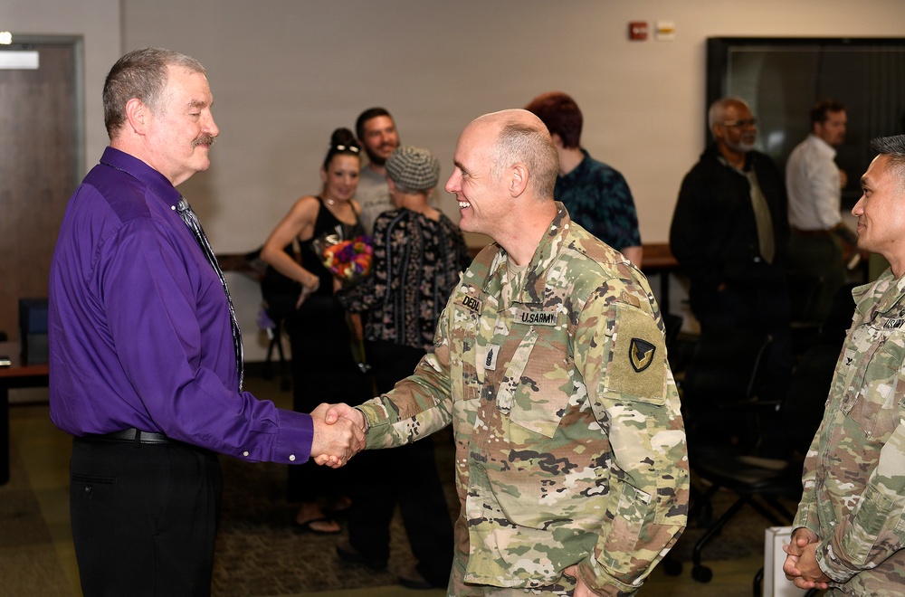 Culihan shakes hands with CSM DeCola