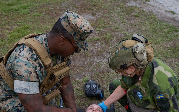U.S. Marines, Sailors, and Swedish Forces conduct CBRN decontamination and medical response training during Archipelago Endeavor 26