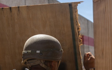U.S. Marines with Golf Co., 2nd Bn., 1st Marines conduct platoon-level urban assaults