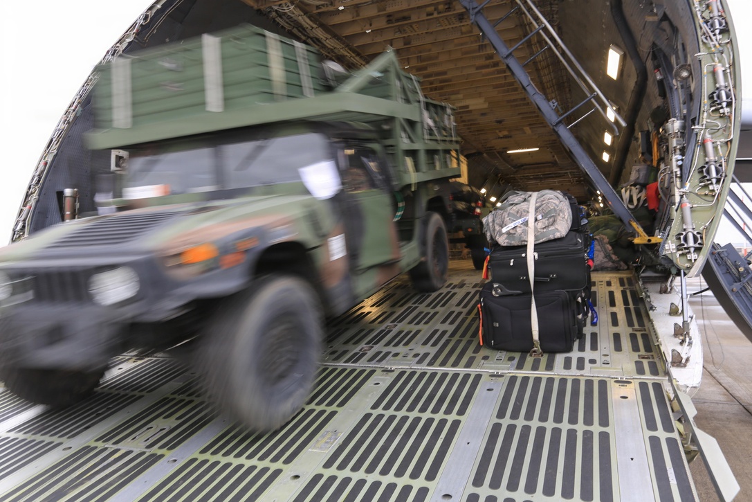 Marines with the 24th Marine Expeditionary Unit offload tactical vehicles at Marine Corps Air Station Cherry Point N.C., Nov. 13, 2012, as they return from an eight-month deployment. The Marines are part of the 24th MEU's Joint Task Force Enabler, or JTFE, section, which was responsible for the coordination of communications assets throughout the entire 24th MEU, both on land and at sea. They were deployed to Naval Air Station Sigonella, Italy.