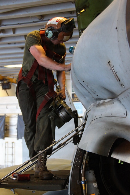 USS IWO JIMA, Mediterranean Sea (Nov. 27, 2012) - A Marine with Marine Medium Tiltrotor Squadron 261 (Reinforced), 24th Marine Expeditionary Unit, disconnects his harness from an MV-22B Osprey after finishing routine maintenance procedures aboard USS Iwo Jima, Nov. 27, 2012. The 24th Marine Expeditionary Unit is deployed with the Iwo Jima Amphibious Ready Group in the 6th Fleet area of responsibility serving as an expeditionary crisis response force capable of a variety of missions, from full-scale combat to evacuations and humanitarian assistance. Since deploying in March, they have supported a variety of missions in the U.S. Central, Africa and European Commands, assisted the Navy in safeguarding sea lanes, and conducted various bilateral and unilateral training events in several countries in the Middle East and Africa. (U.S. Marine Corps photo by Lance Cpl. Tucker S. Wolf/Released)