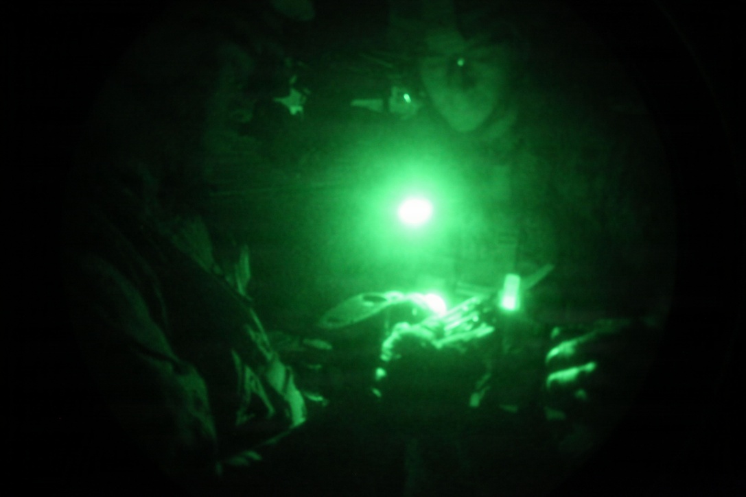 Marines with Security Platoon, Headquarters and Service Company, Battalion Landing Team 1st Battalion, 2nd Marine Regiment, 24th Marine Expeditionary Unit, checks his shot group after conducting a night live-fire training exercise aboard USS Iwo Jima, Dec. 9, 2012. The 24th MEU is deployed with the Iwo Jima Amphibious Ready Group and is currently in the 6th Fleet area of responsibility. Since deploying in March, they have supported a variety of missions in the U.S. Central, Africa and European Commands, assisted the Navy in safeguarding sea lanes, and conducted various bilateral and unilateral training events in several countries in the Middle East and Africa. (U.S. Marine Corps photo by Lance Cpl. Tucker S. Wolf/Released)