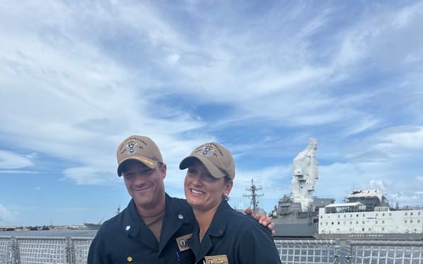 CDR Bruce Hallett congratulates LTJG Anna Freyman on her designation as a Surface Warfare Officer
