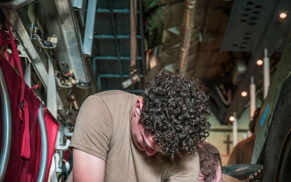 Joint service members load cargo for Nepal lifesaving operations